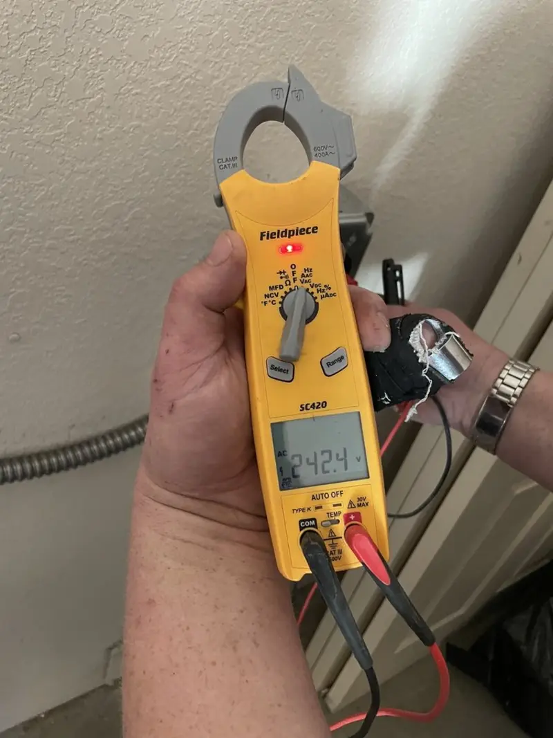 Voltage testing with clamp meter during Electrical Installation Services in Sanibel
